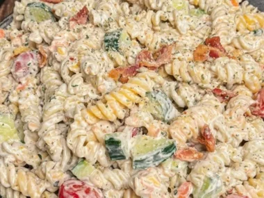 Creamy bacon ranch pasta salad in a bowl with fresh ingredients