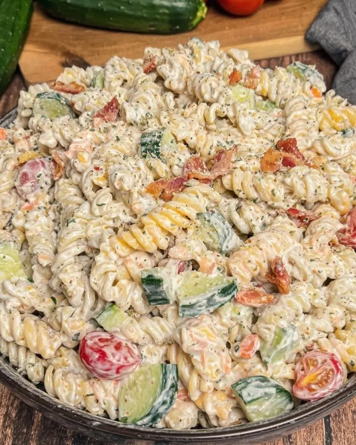 Creamy bacon ranch pasta salad in a bowl with fresh ingredients