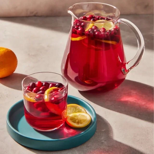 Homemade cranberry juice served in a glass with fresh cranberries