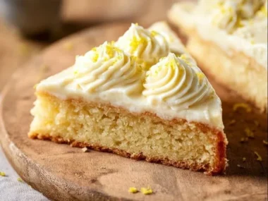 A moist Giant Lemon Cookie Cake topped with lemon icing and zest.