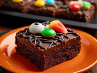 Halloween brownie treats with spooky decorations and chocolate drizzle