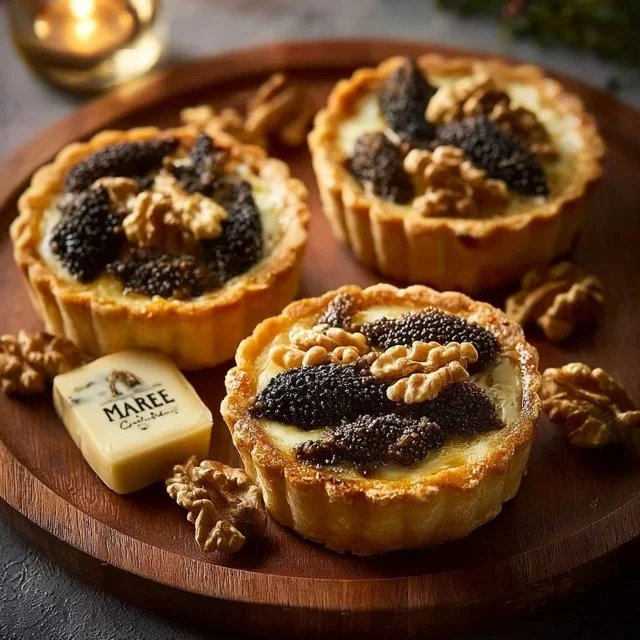 A delicious morel tart featuring flaky pastry and fresh morel mushrooms, garnished elegantly.