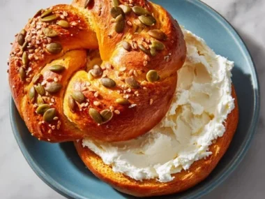 Freshly baked pumpkin bagels topped with seeds and cinnamon