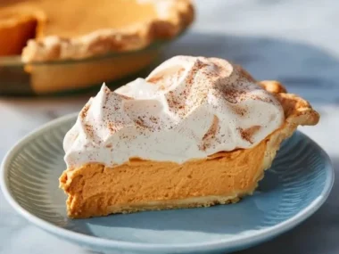 Delicious slice of Pumpkin Chiffon Pie topped with whipped cream