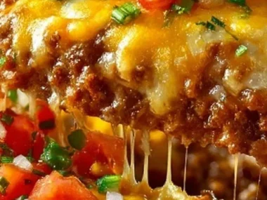 Delicious Cattle Drive Casserole served in a rustic dish with toppings.