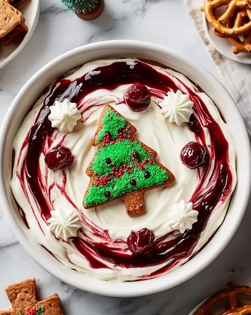 A festive Christmas Tree Cake Dip served in a bowl, decorated for the holidays.