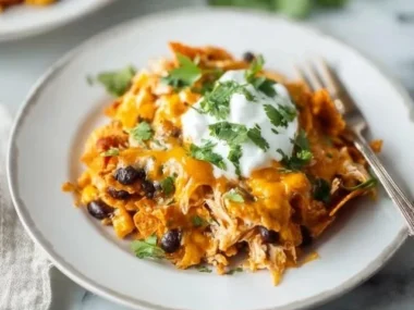 Delicious Doritos Chicken Casserole topped with crunchy Doritos chips