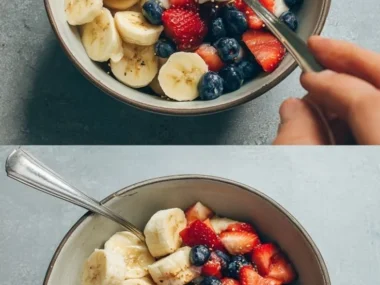 Homemade frozen donuts for dogs featuring fruit, perfect for summer festivities.