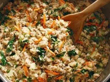 Homemade stovetop dog food recipe cooking in a pan for nutritious pet meals