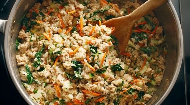 Homemade stovetop dog food recipe cooking in a pan for nutritious pet meals