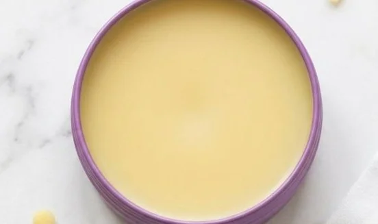 Homemade dog paw balm in a jar, designed to nourish and protect dog paws.