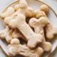 A variety of homemade dog treats for your furry friends on a wooden table.