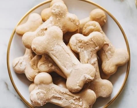 A variety of homemade dog treats for your furry friends on a wooden table.