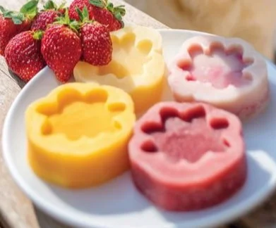 Mango and Strawberry Frozen Dog Treats in a bowl for pets