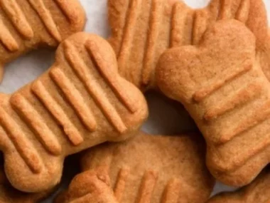 Homemade peanut butter dog treats on a wooden table