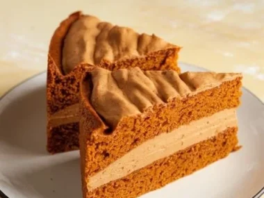 Delicious pumpkin and peanut butter dog cake for dogs celebrating their special day.