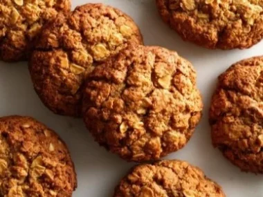 Homemade pumpkin oat cookies for dogs on a wooden table