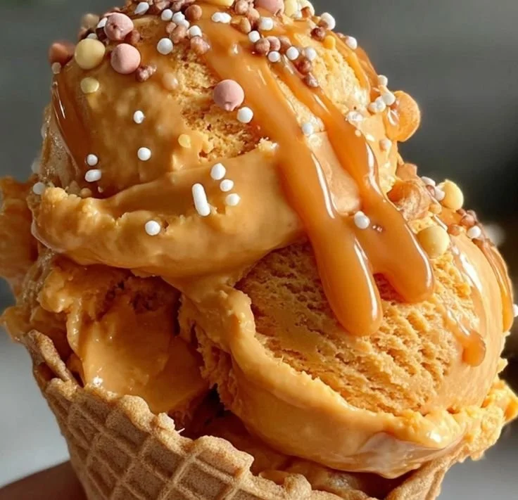 Pumpkin Peanut Butter Doggy Ice Cream served in a bowl for dogs