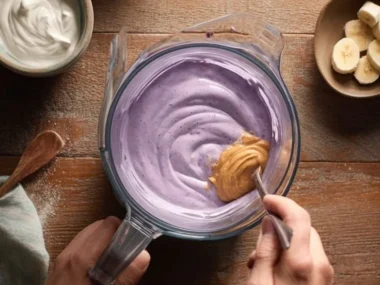 Bowl of homemade Pup Ice Cream for dogs topped with dog-friendly toppings