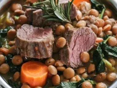 A bowl of dog-friendly lamb and lentil stew with fresh ingredients