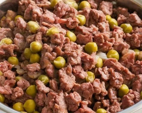 Homemade beef and pea dog food recipe for a healthy pet meal.