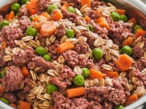 A bowl of homemade dog food with fresh ingredients and vegetables