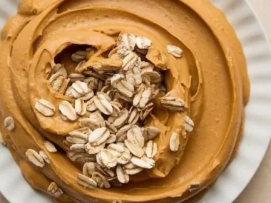 Dog enjoying a Kong toy filled with peanut butter