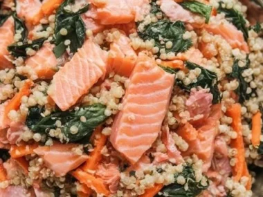 Salmon and quinoa power bowl with veggies and dressing