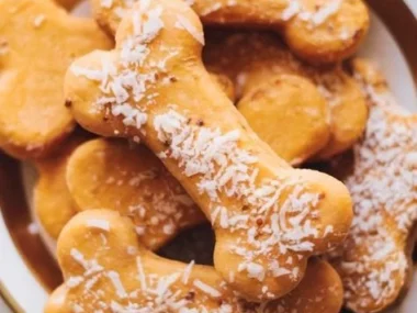 Homemade Sweet Potato Dog Treats in a bowl with a paw print design