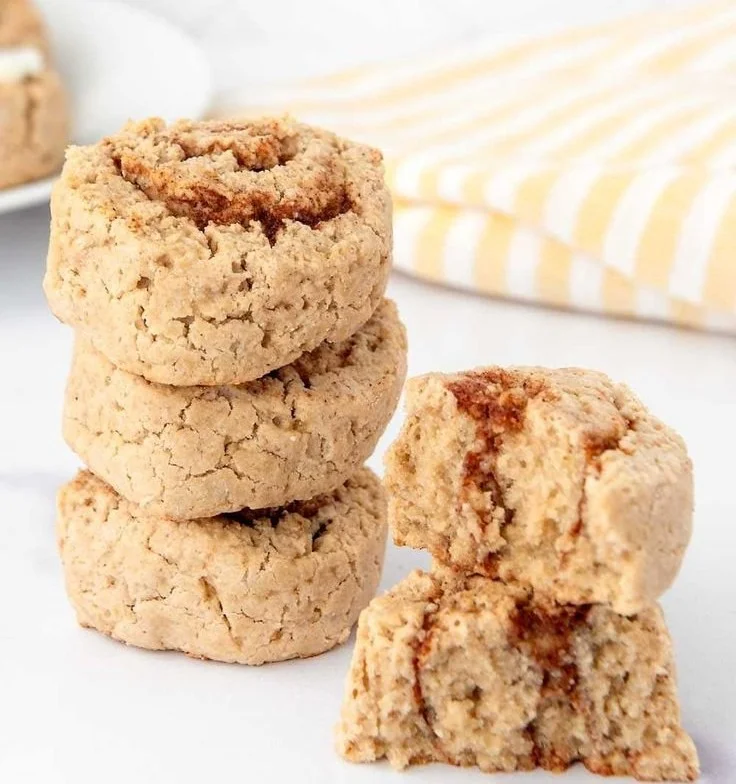 Freshly baked cinnamon roll dog treats on a wooden table