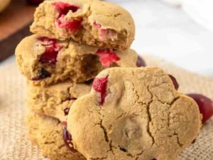 Homemade cranberry dog treats on a wooden surface