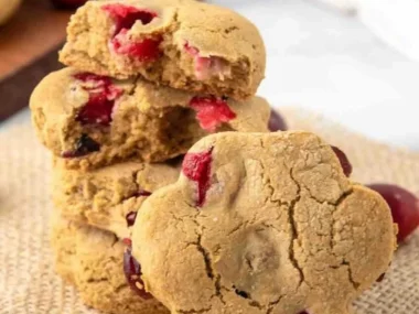 Homemade cranberry dog treats on a wooden surface
