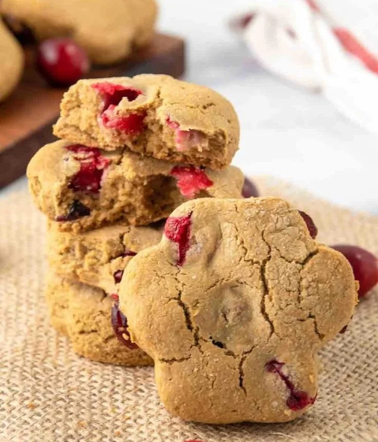 Homemade cranberry dog treats on a wooden surface