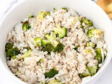 A bowl of homemade dog food featuring fish, healthy ingredients for dogs