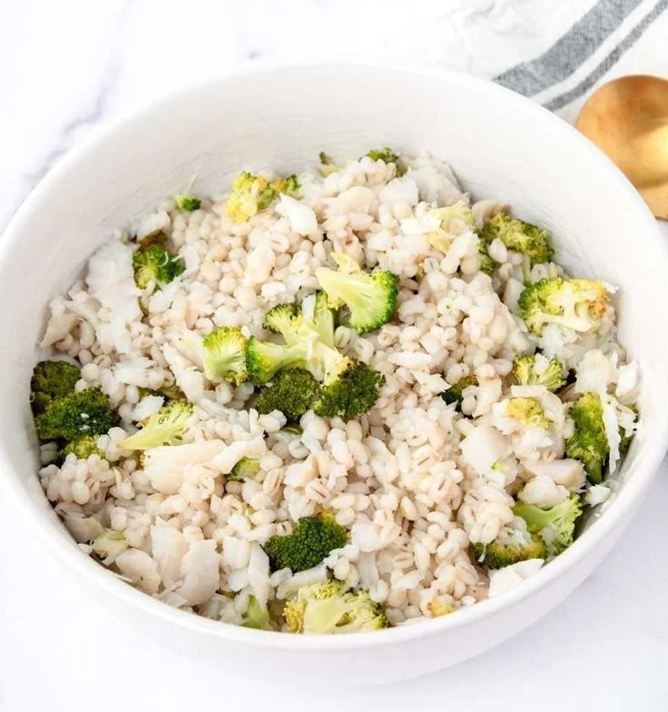 A bowl of homemade dog food featuring fish, healthy ingredients for dogs