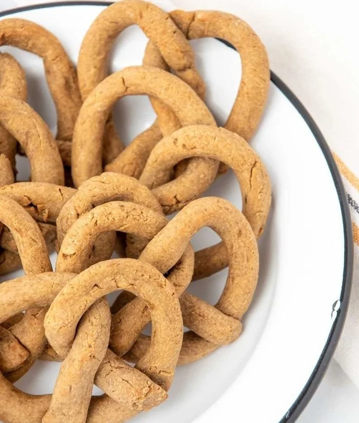 Dog enjoying a safe, homemade pretzel treat