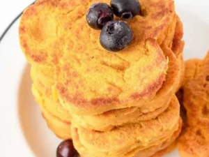 Homemade pumpkin pancakes for dogs served on a plate