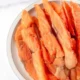 Salmon jerky treats for dogs in a bowl, healthy pet snack