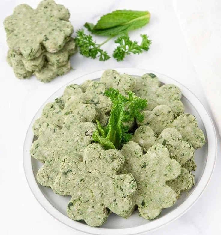 St. Patrick's Day themed dog treats in green shapes and colors for dogs
